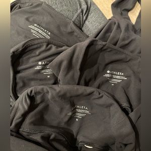 4 pairs of athleta ultra high rise elation tights in black.